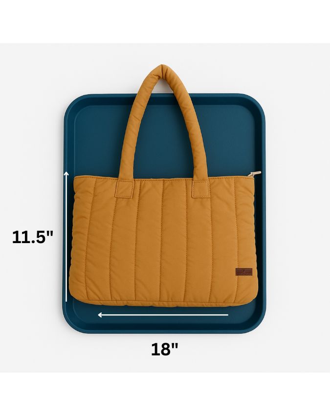 Trendy quilted puffer tote bag with soft padded handles and vertical stitch design – spacious, lightweight, and perfect for daily use, college, travel, or streetwear looks. A bold fashion essential from Tales of Totes, offering comfort and style beyond typical canvas bags on Indian marketplaces like Amazon, Flipkart, and Myntra. Competes with brands like Zouk, Chumbak, and DailyObjects."
