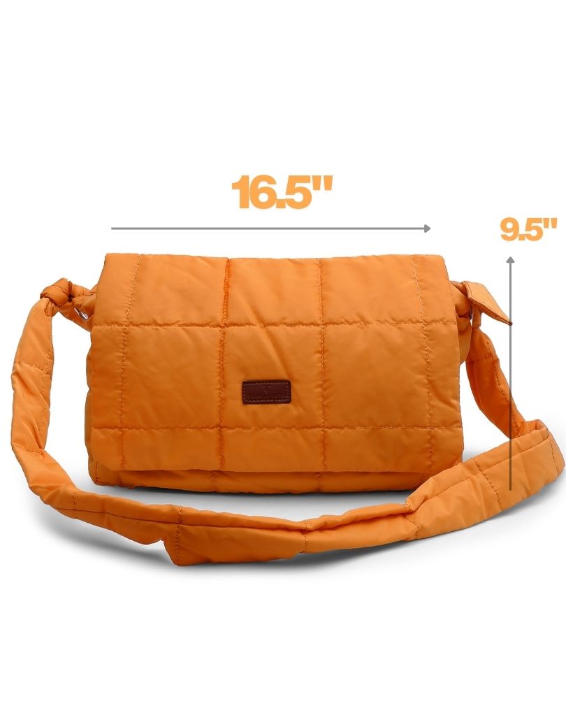 Quilted shoulder bag with a padded design, knotted strap detail, and soft structured silhouette – lightweight, functional, and perfect for daily use or casual outings. Compact yet spacious, ideal for carrying essentials in style. A statement accessory from Tales of Totes, offering cozy fashion-forward appeal for Indian shoppers.