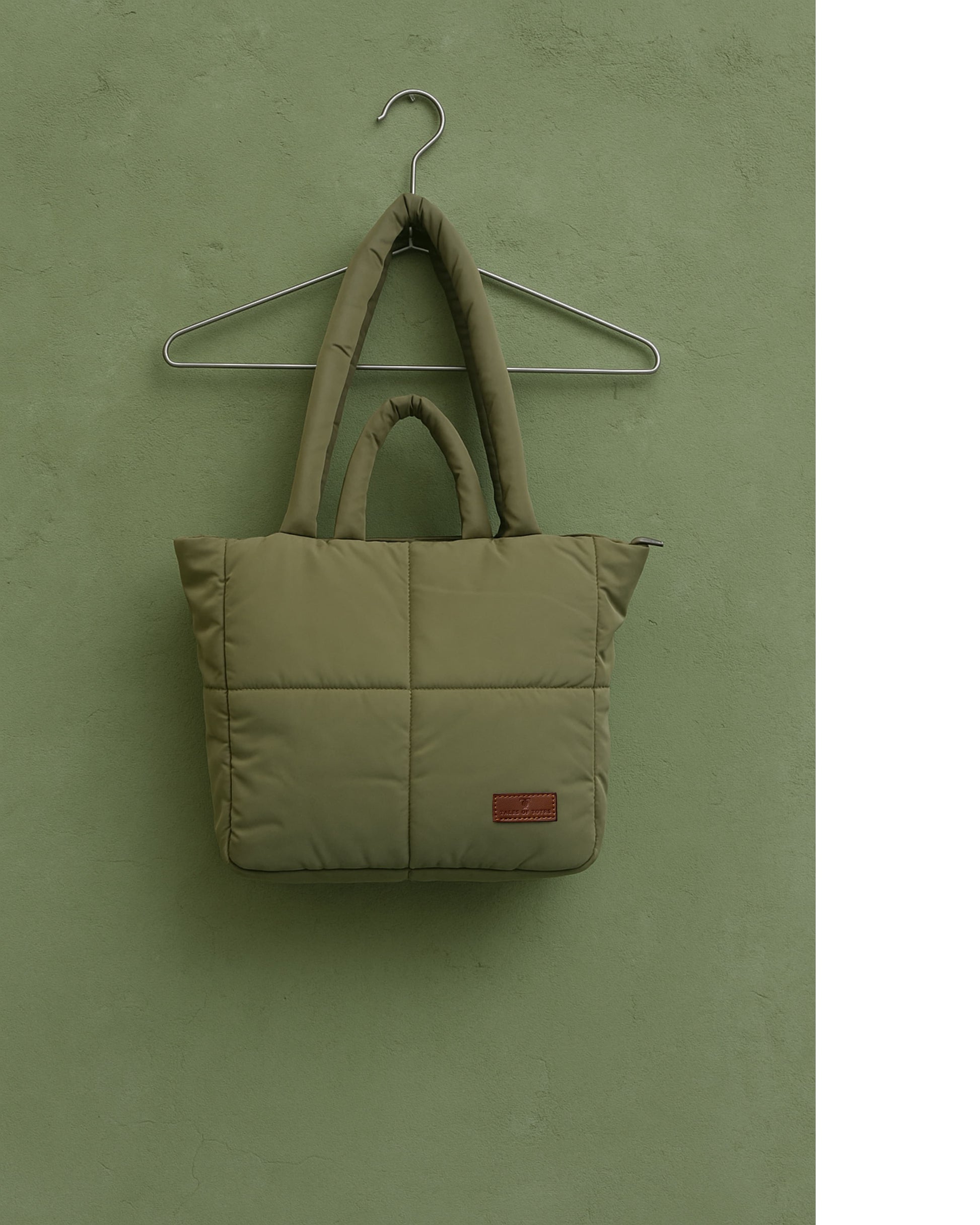 Stylish quilted puffer tote bag with padded handles and box-stitched detailing – ultra-lightweight, roomy, and perfect for everyday use. Ideal for college, shopping, or casual streetwear looks. A trendy fashion essential from Tales of Totes, offering cozy-chic appeal beyond standard canvas bags on Indian platforms like Myntra, Flipkart, and Amazon."