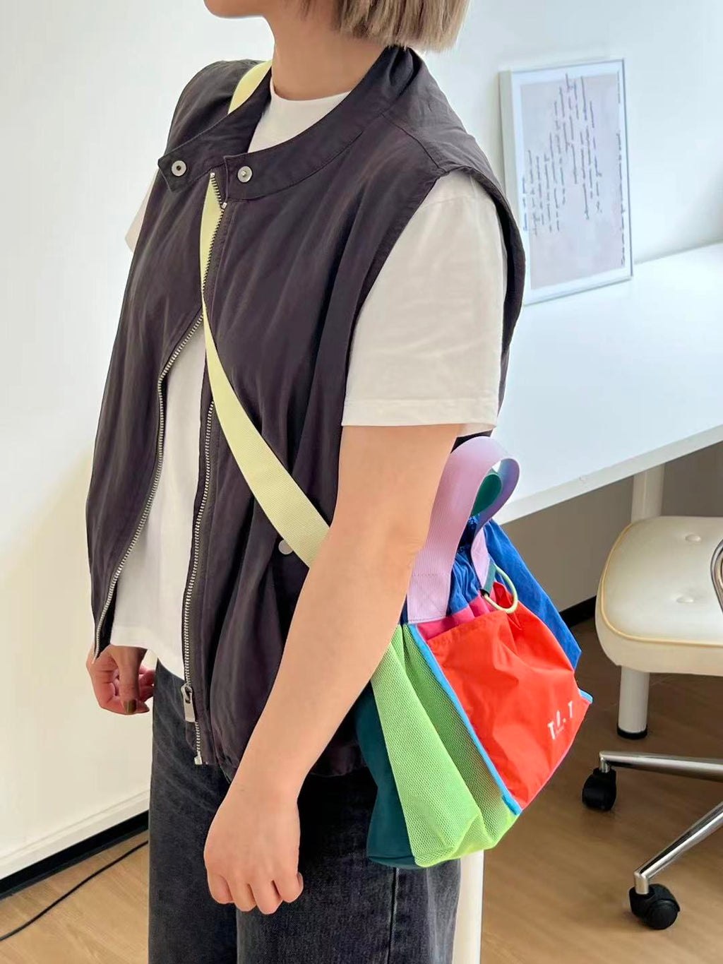 Trendy multi-color casual college tote bag with mesh detailing and adjustable straps.