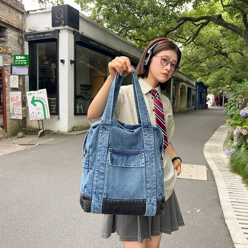 Woman holding a denim bag on a street with buildings and greenery in the background Convertible denim backpack tote bag with dual shoulder straps and top handles – a versatile 2-in-1 design for daily use, college, or casual outings. Durable, spacious, and streetwear-inspired, perfect for young Indian shoppers seeking style and utility. Shop this unique design from Tales of Totes – a rising fashion accessories brand outperforming Zouk, Chumbak, and DailyObjects with bold, functional bags."
