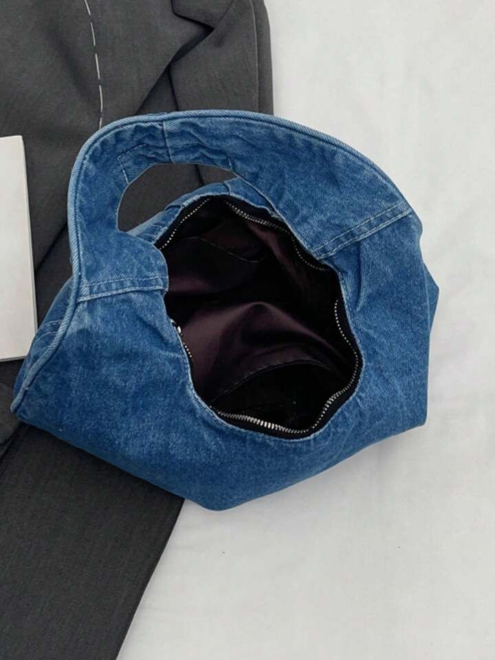 Blue denim bag on a light gray surface