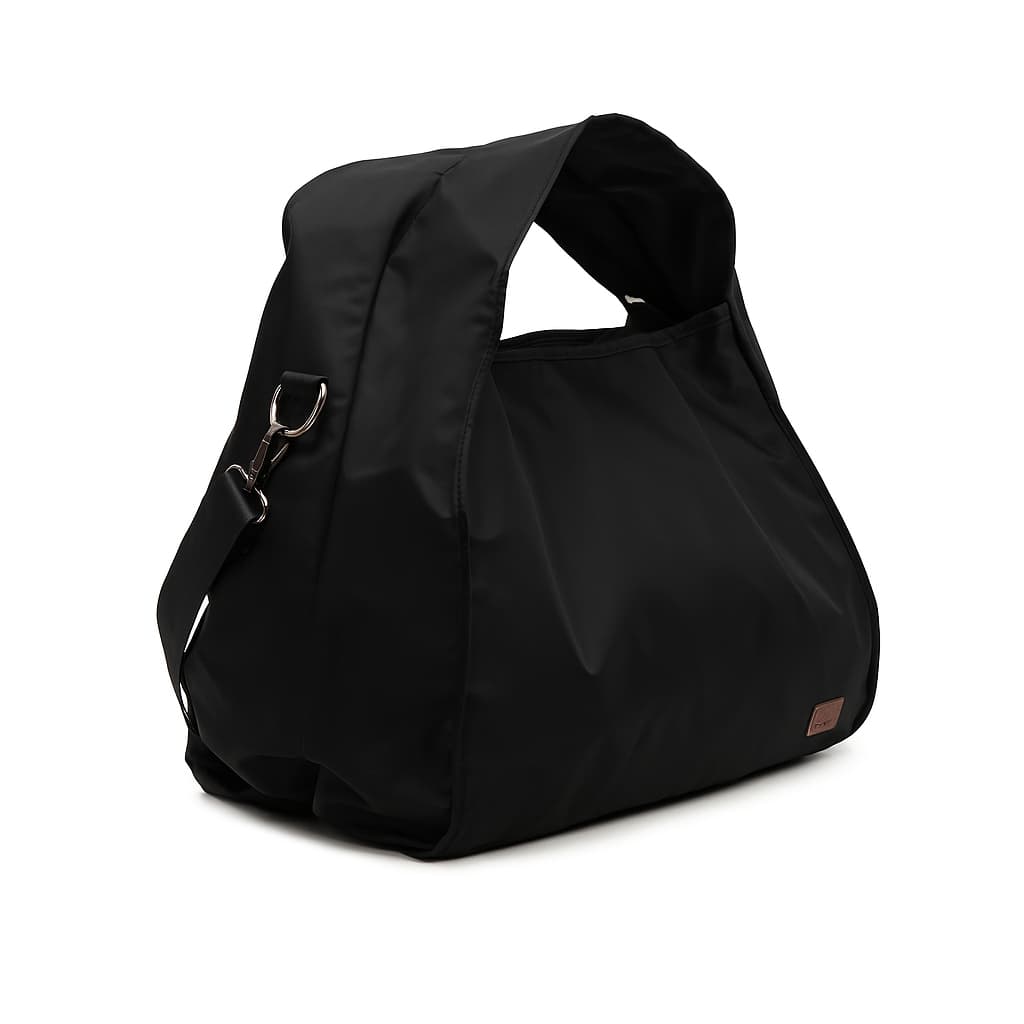 Minimalist black tote bag with a padded top handle, detachable crossbody strap, and front zipper pocket – made from water-resistant fabric for everyday functionality. Lightweight yet spacious, ideal for travel, office, gym, or casual use. A sleek and versatile design by Tales of Totes, offering modern utility and elevated style for Indian shoppers."