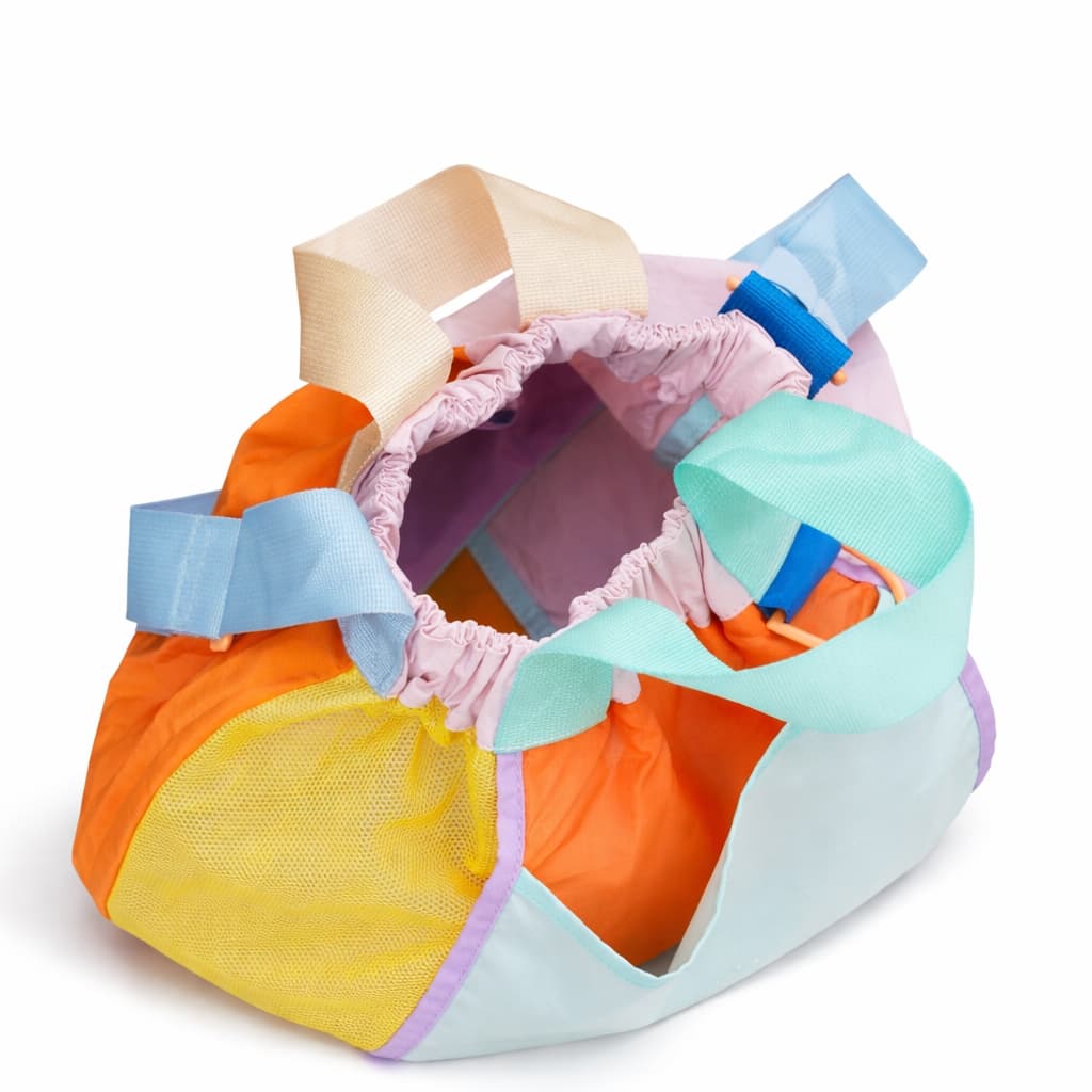 Colorful diaper bag with multiple compartments on a white background