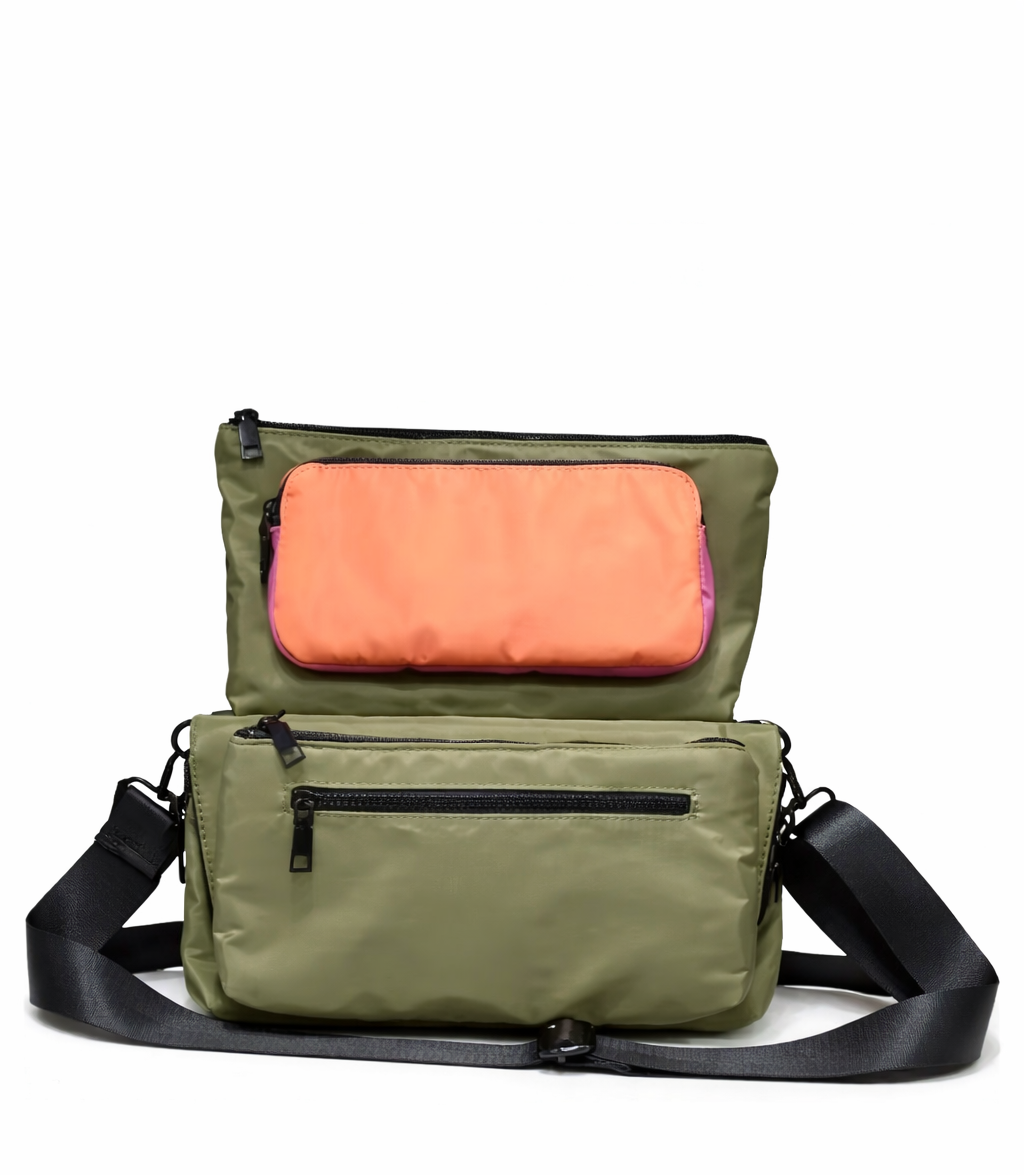 Green shoulder bag with a pink interior on a white background