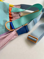 Trendy multi-color casual college tote bag with mesh detailing and adjustable straps.