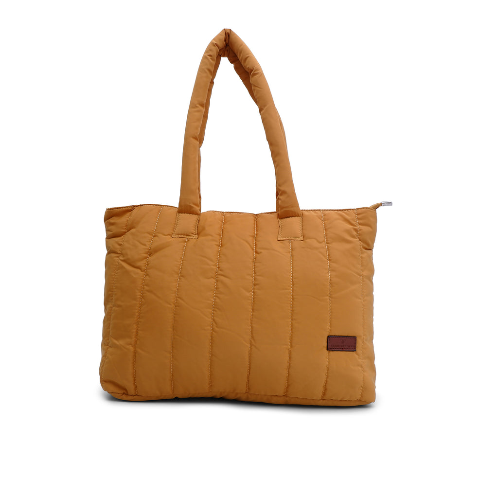 Trendy quilted puffer tote bag with soft padded handles and vertical stitch design – spacious, lightweight, and perfect for daily use, college, travel, or streetwear looks. A bold fashion essential from Tales of Totes, offering comfort and style beyond typical canvas bags on Indian marketplaces like Amazon, Flipkart, and Myntra. Competes with brands like Zouk, Chumbak, and DailyObjects."
