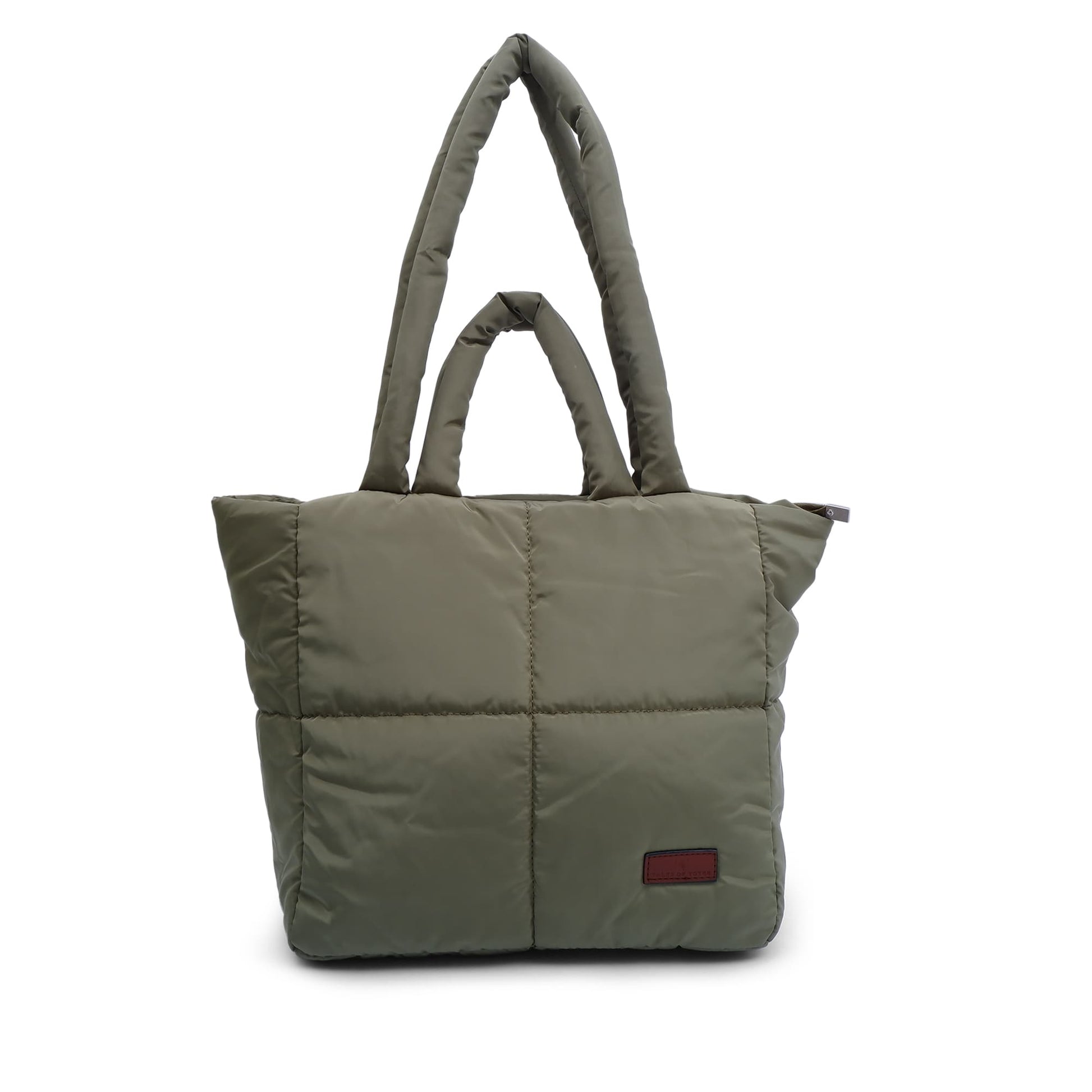 Green quilted tote bag with a red label on a white background "Minimalist shoulder bag with a structured silhouette, single top strap, and attached tag detail – designed for effortless everyday style. Compact yet spacious enough for daily essentials, perfect for work, brunch, or casual wear. A premium fashion accessory from Tales of Totes, ideal for Indian shoppers seeking elegant, functional handbags beyond standard tote designs."
