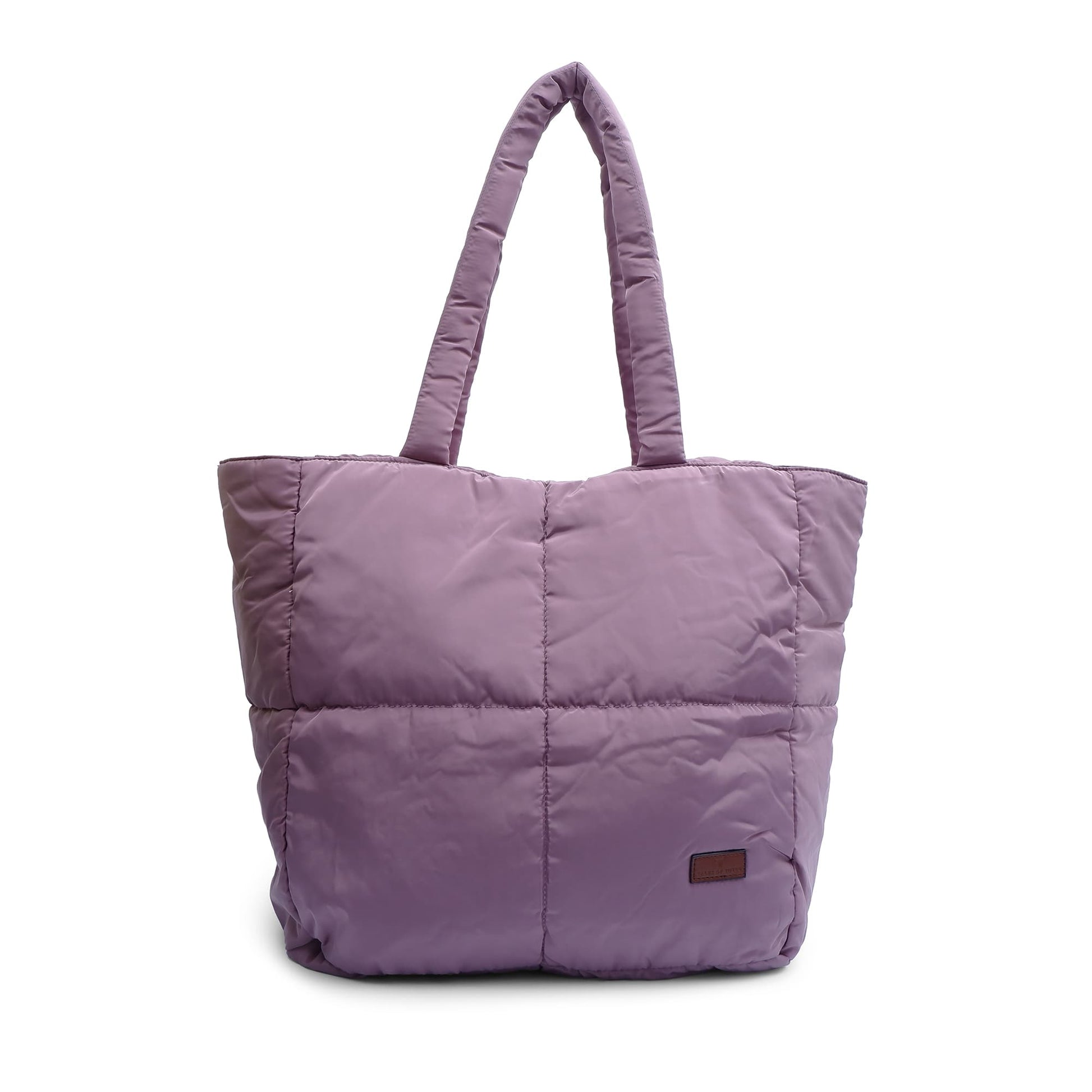 Purple quilted tote bag on a white background Quilted puffer tote bag with padded handles and a soft structured silhouette – lightweight, stylish, and perfect for daily use, college, travel, or shopping. Designed for comfort and statement appeal, this spacious carryall from Tales of Totes is a trendy alternative to Zouk, Lavie, and DailyObjects in India’s fashion accessories market."