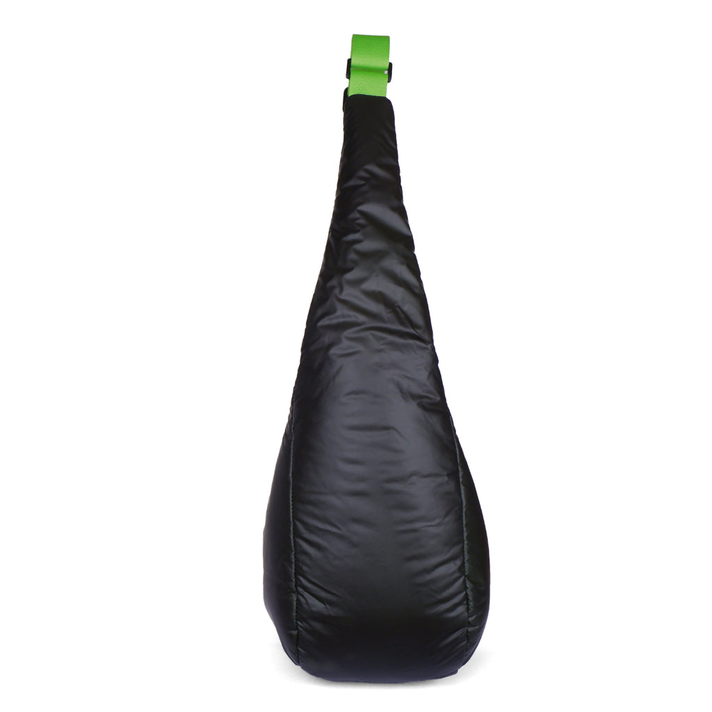 Black sling bag with a green strap on a white background