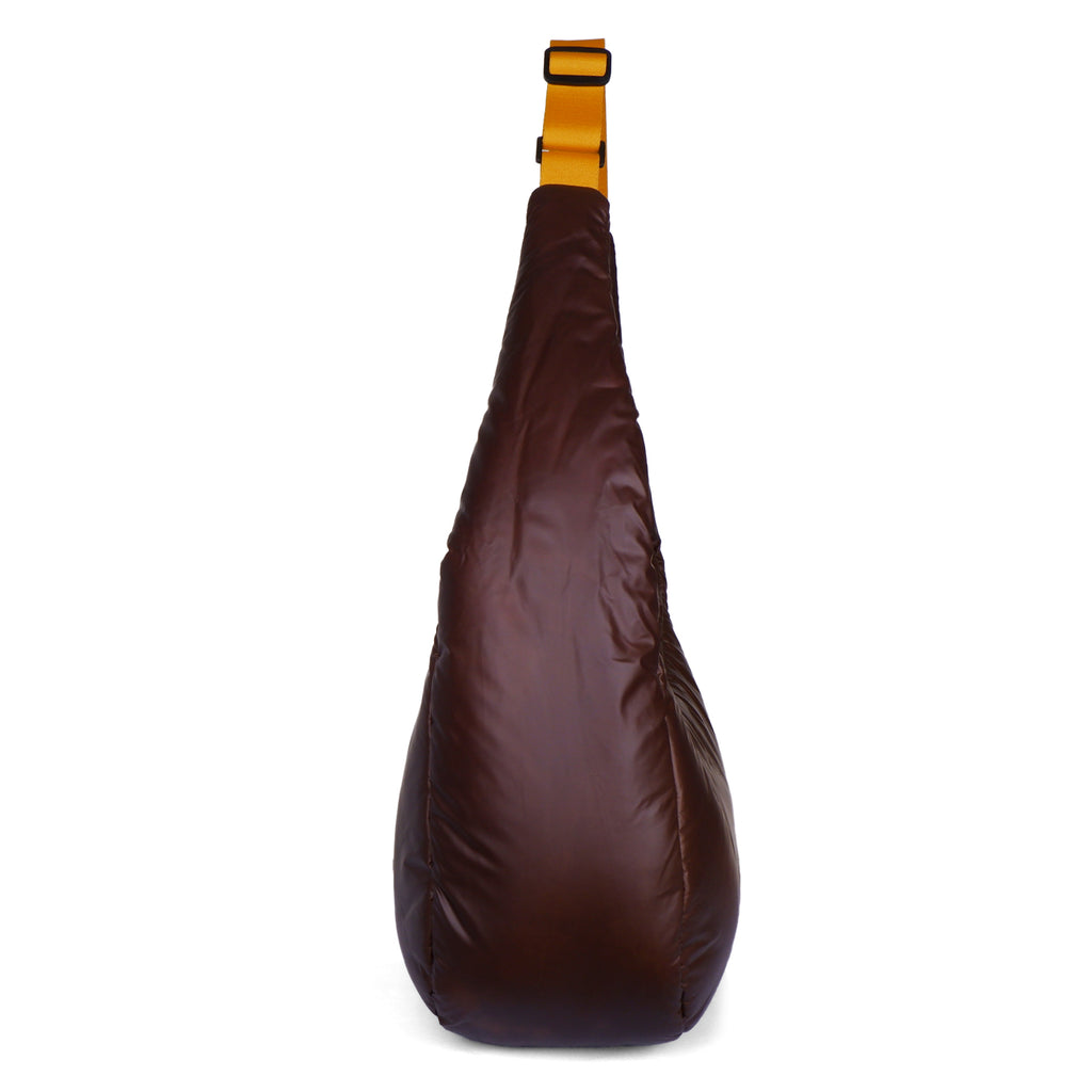 Brown sling bag with a yellow strap on a white background