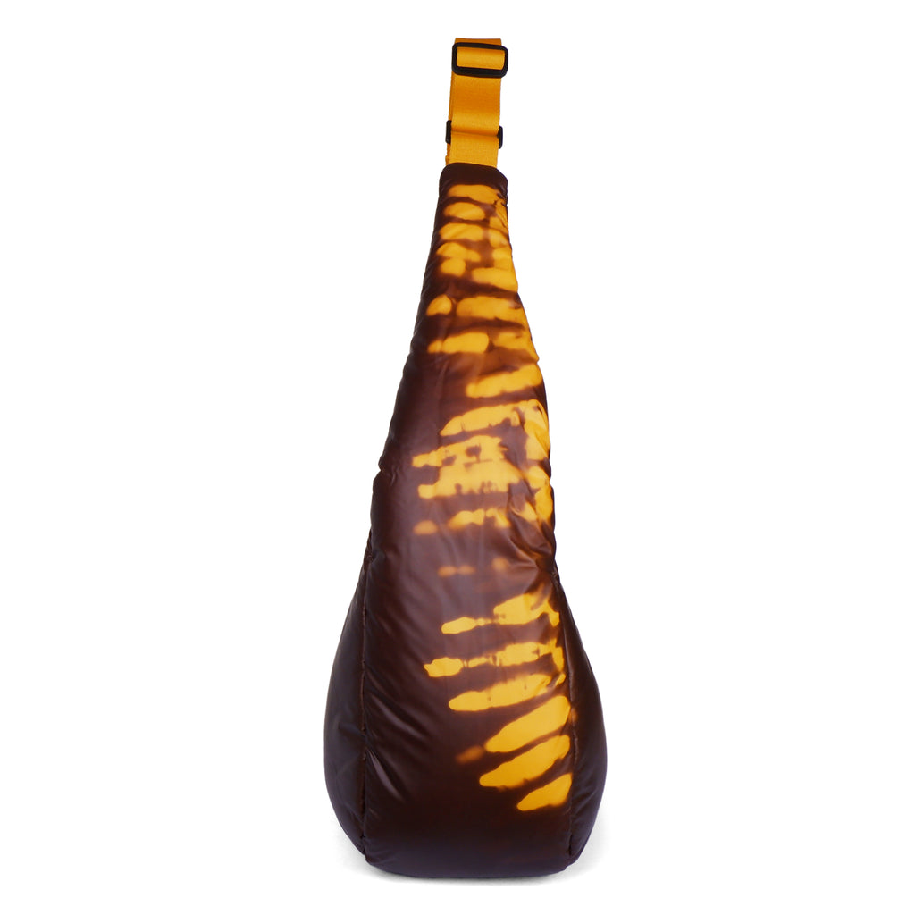 Tortoiseshell-patterned sling bag on a white background