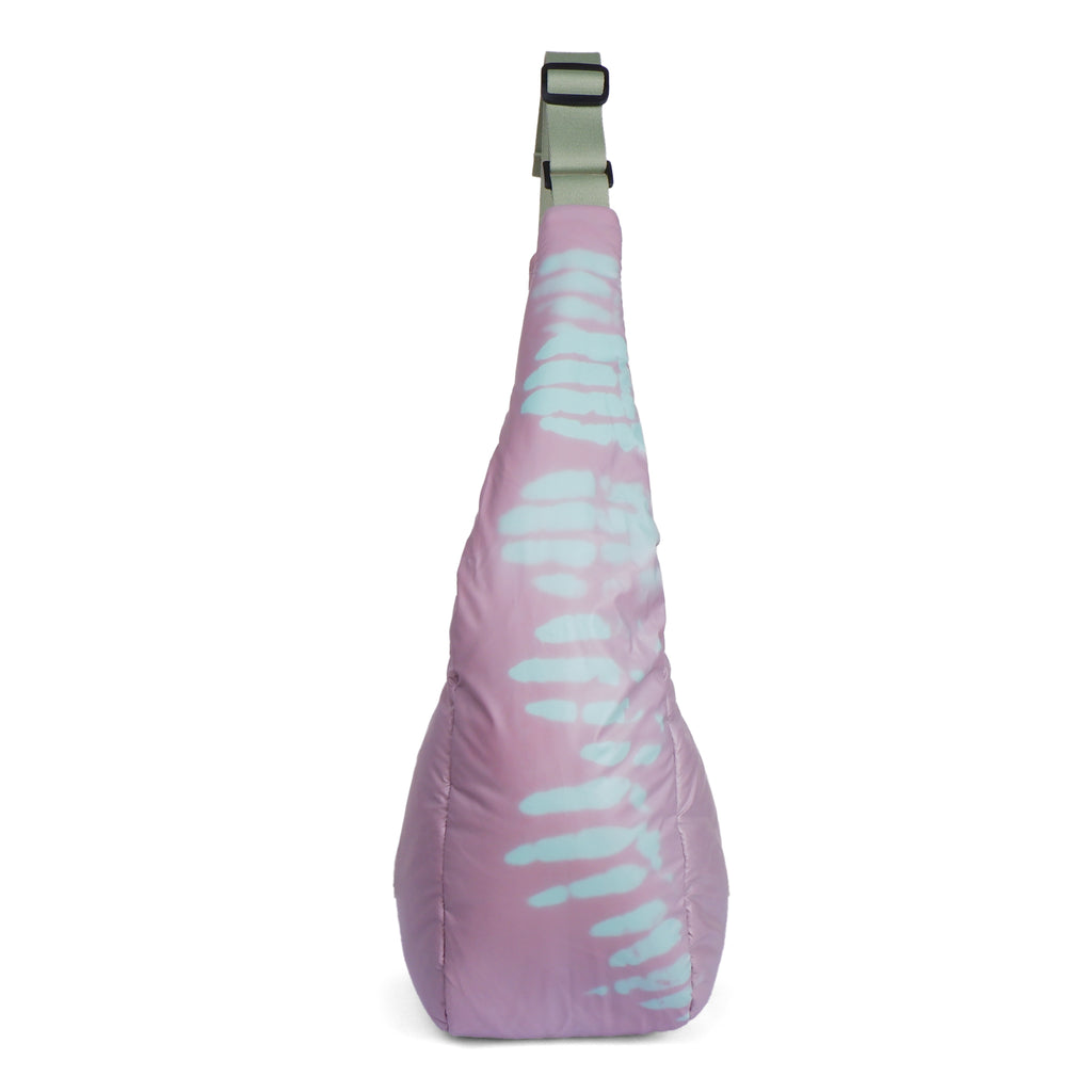Purple sling bag with light blue abstract pattern on a white background