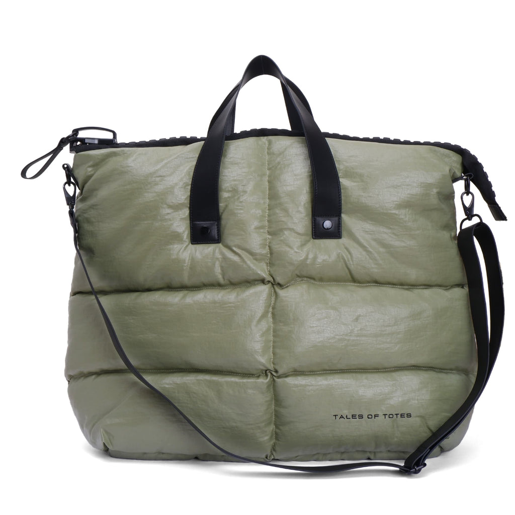 Green puffer bag with black straps on a white background