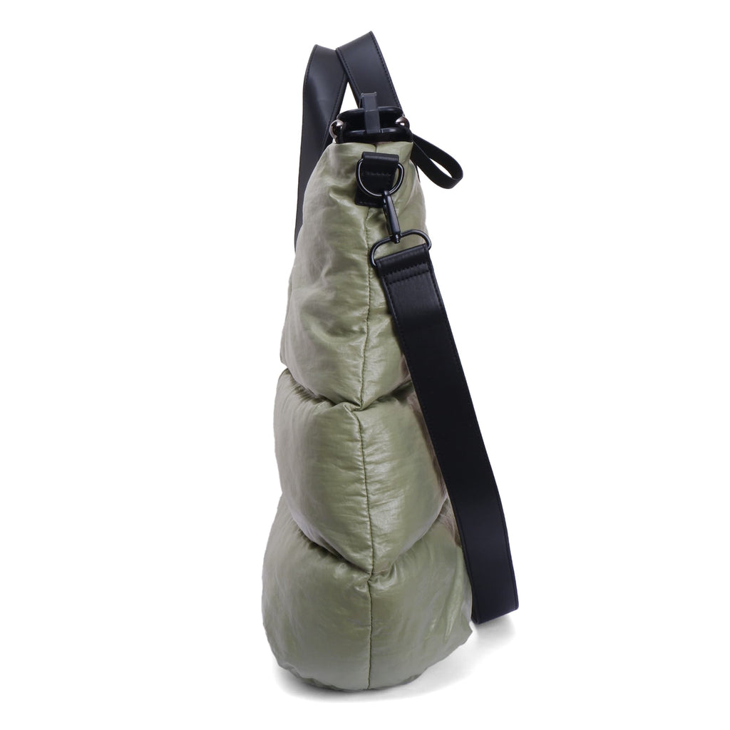 Green bag with a black strap on a white background