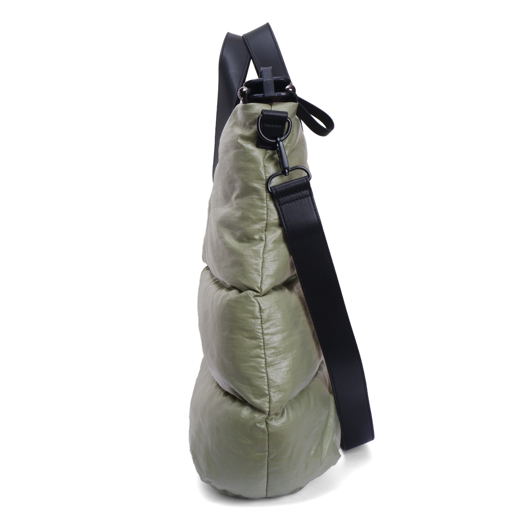 Green bag with a black strap on a white background