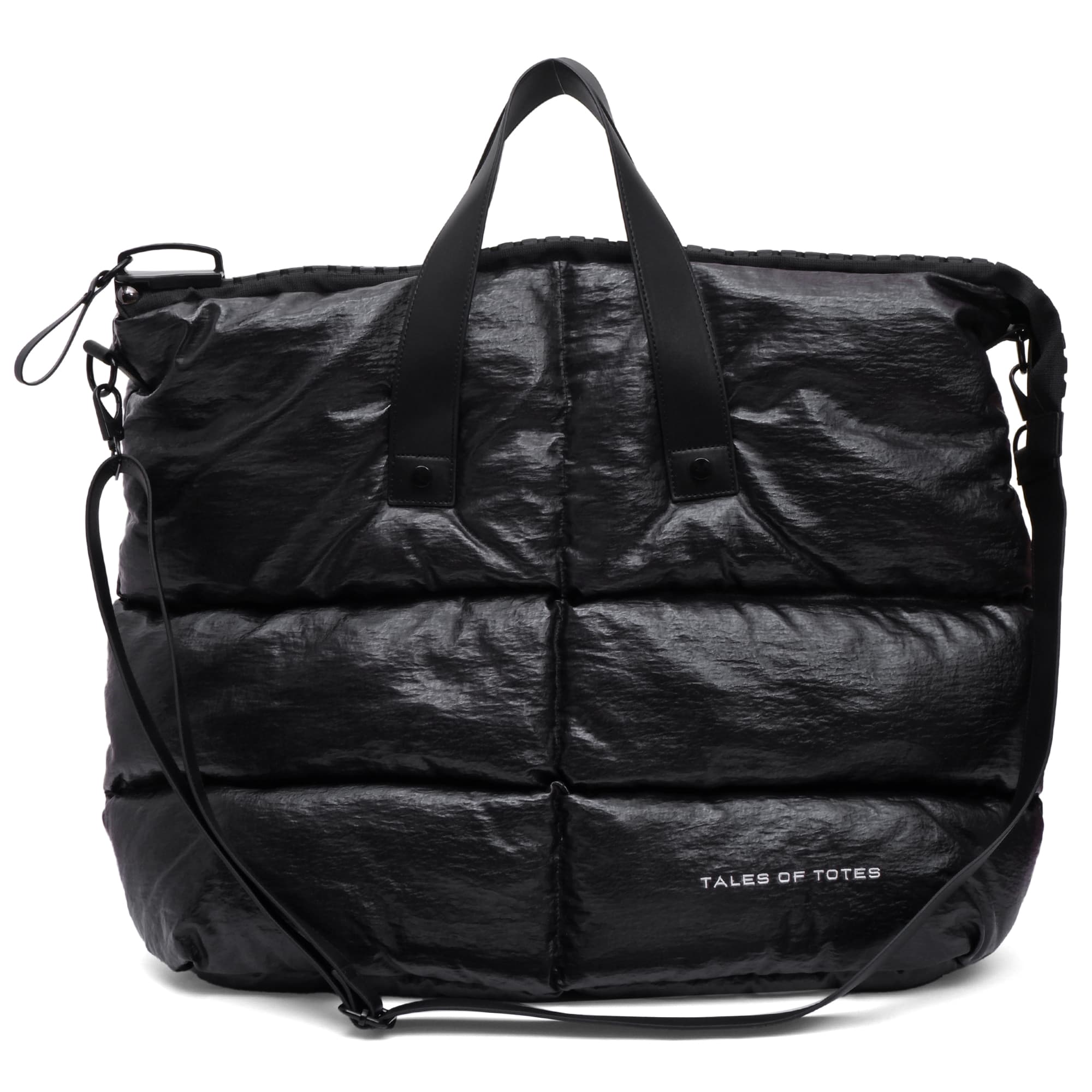 Black quilted duffel bag with shoulder strap on a white background