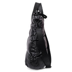 Black backpack with a strap on a white background