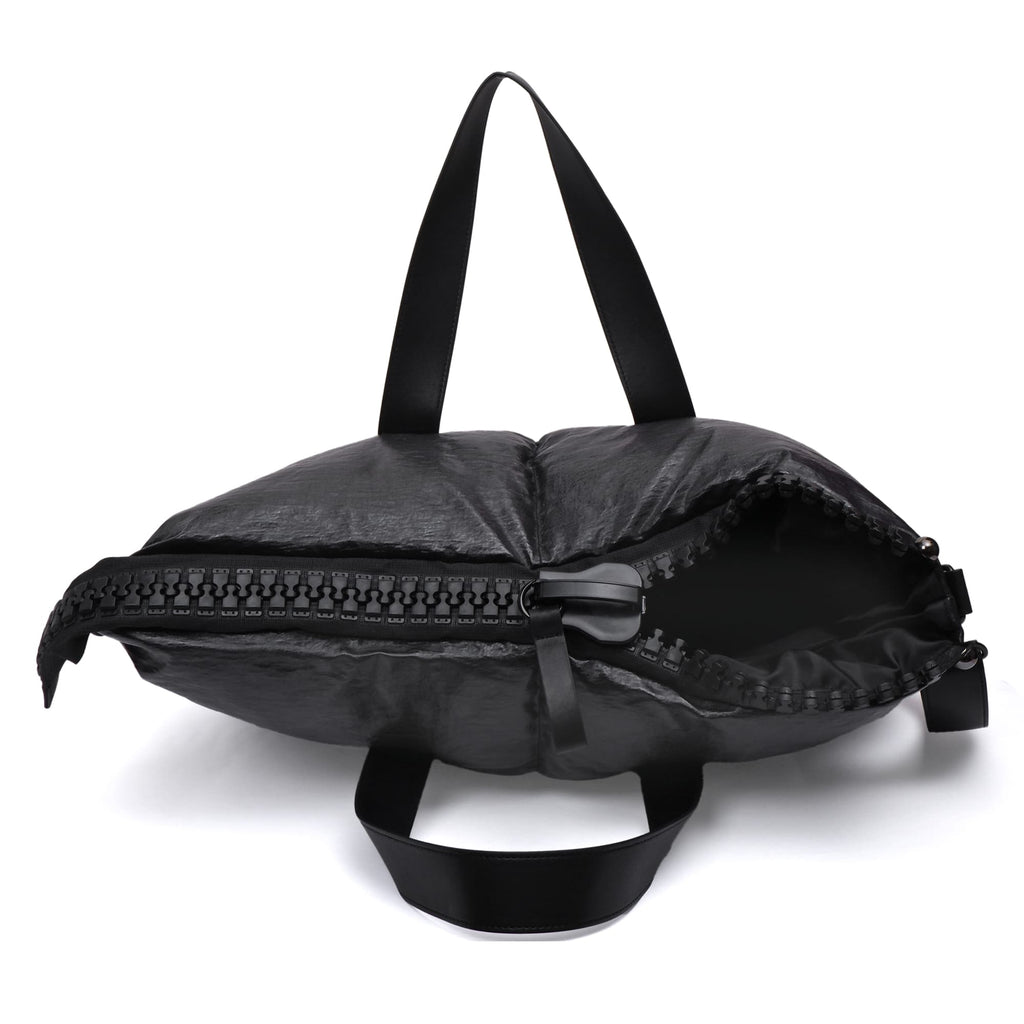 Black backpack with a zipper on a white background