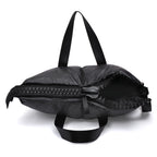 Black backpack with a zipper on a white background
