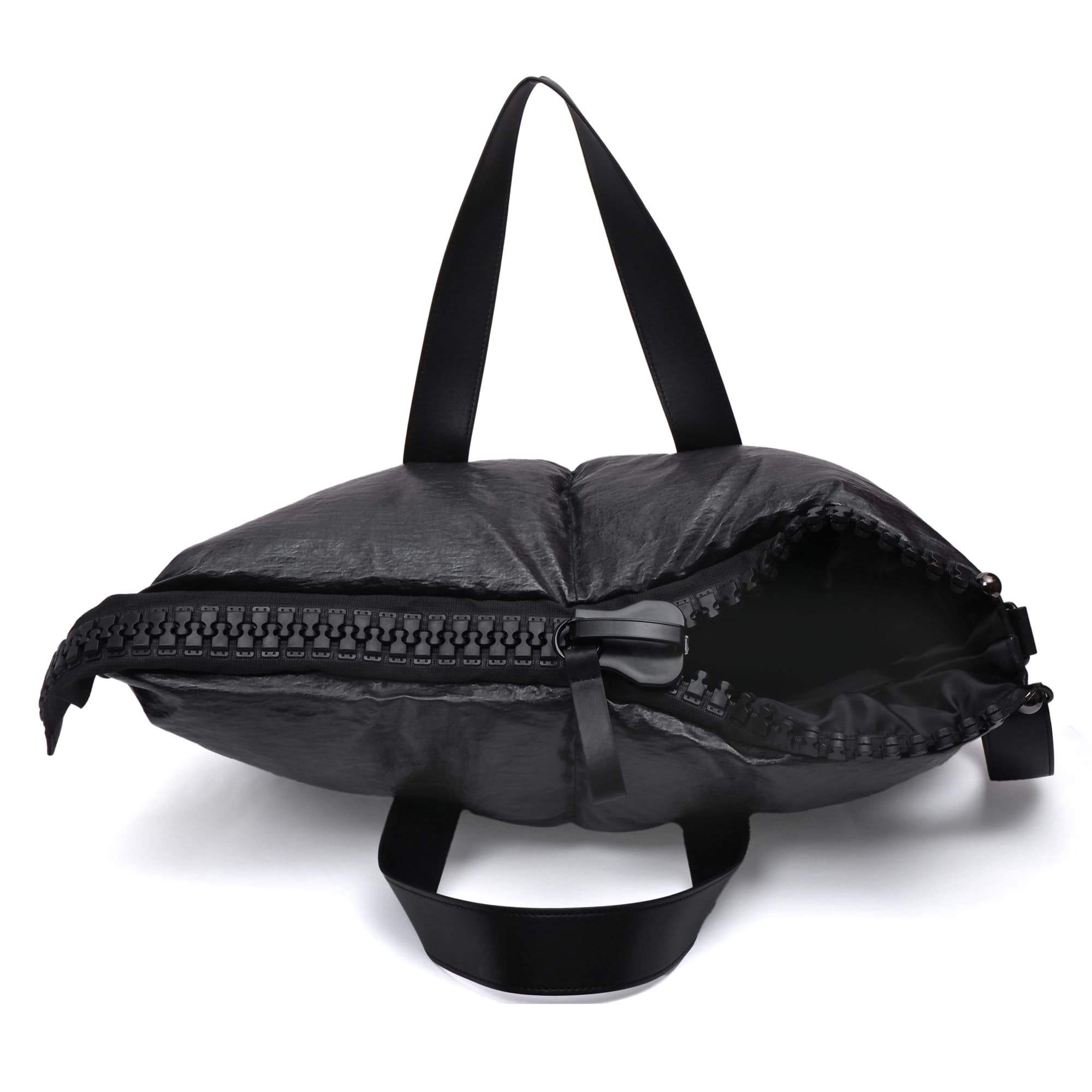 Black backpack with a zipper on a white background