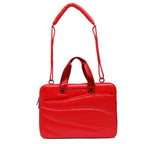 Red handbag with a visible brand name on a white background