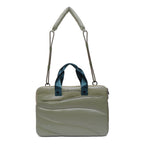 Light green handbag with a blue handle on a white background