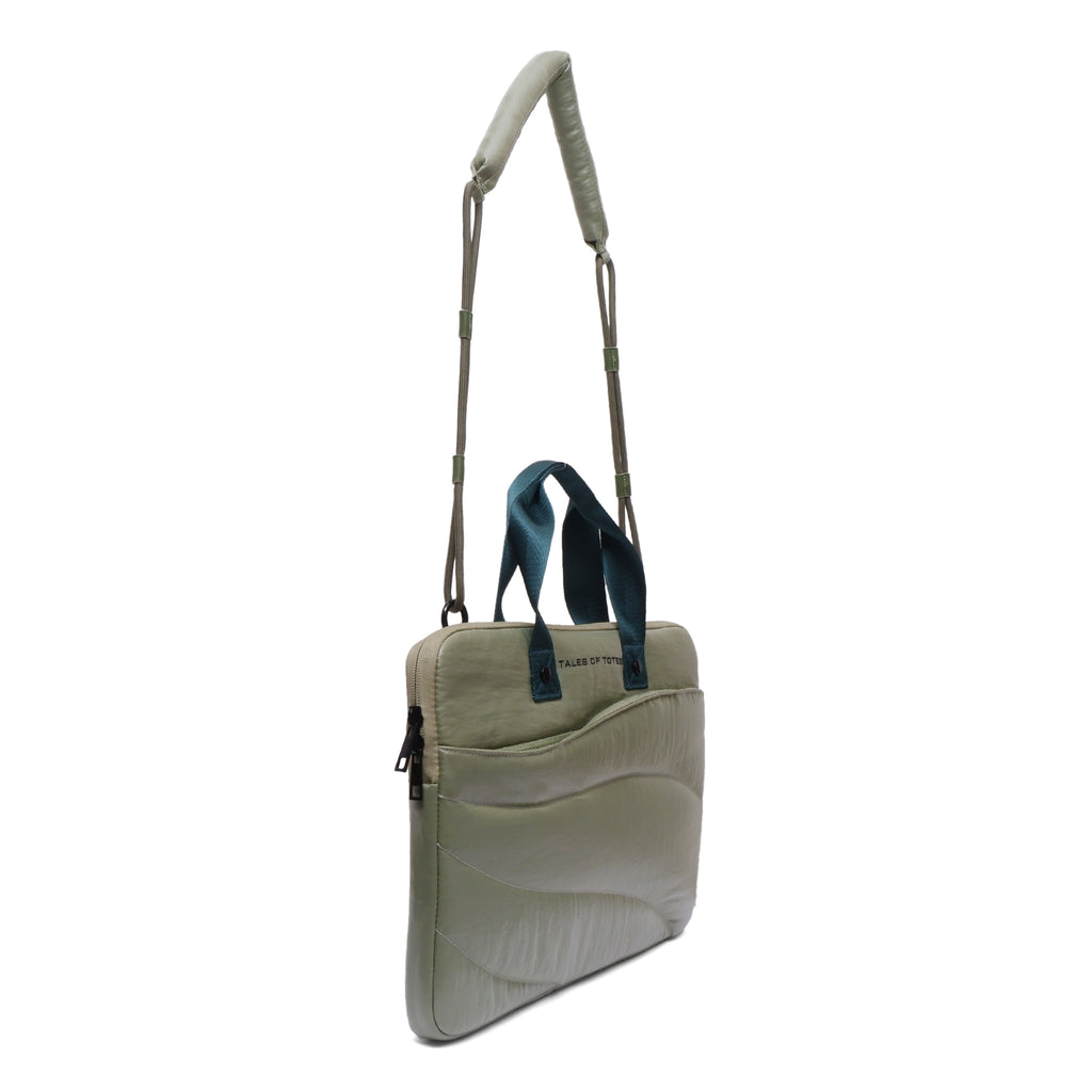 Light gray crossbody bag with a shoulder strap on a white background