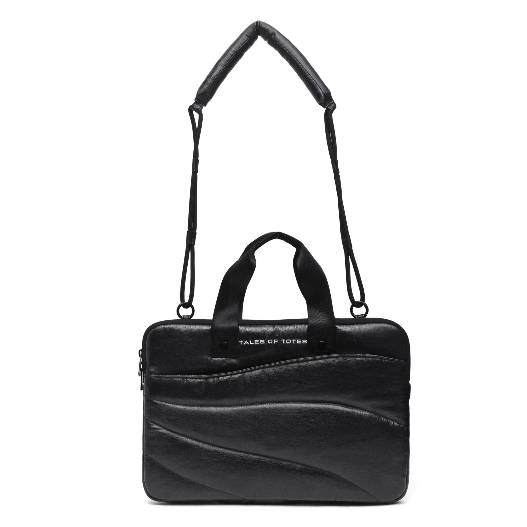 Black leather handbag with a strap on a white background