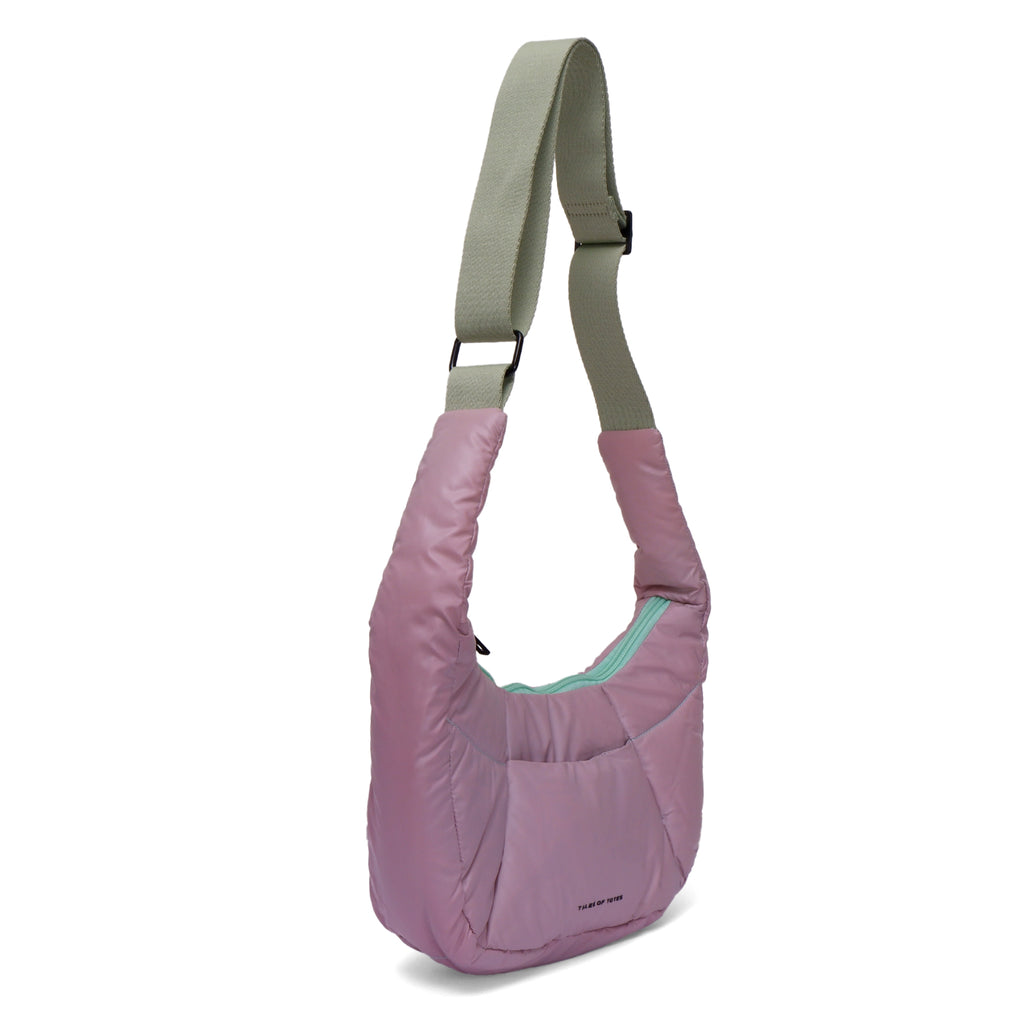 Purple shoulder bag with a green zipper on a white background