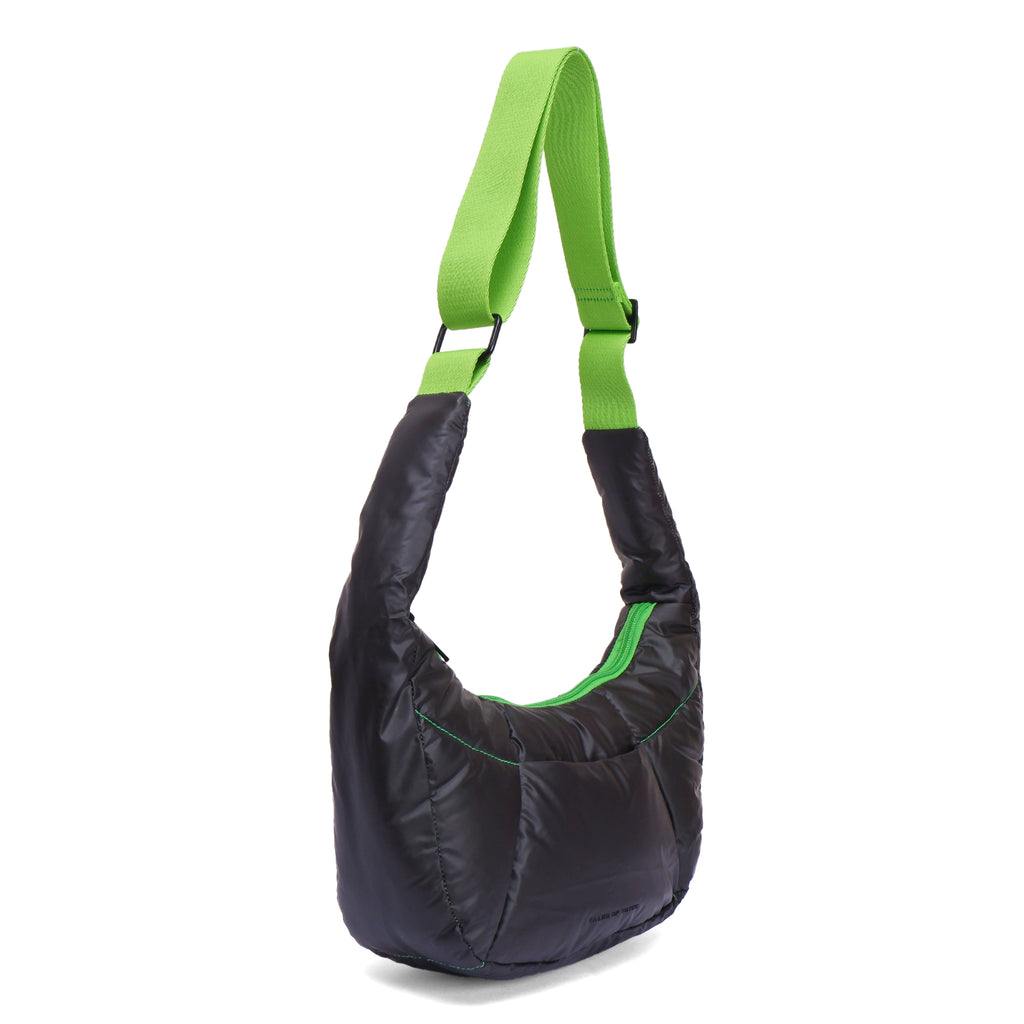 Black shoulder bag with green straps on a white background
