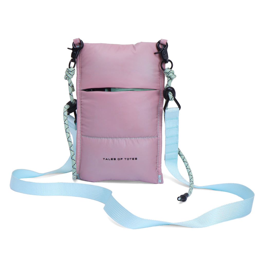 Pink crossbody bag with a light blue strap on a white background