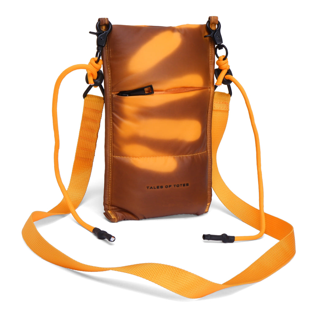 Orange crossbody bag with a strap on a white background