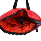 Red bag with black zipper and handles on a white background