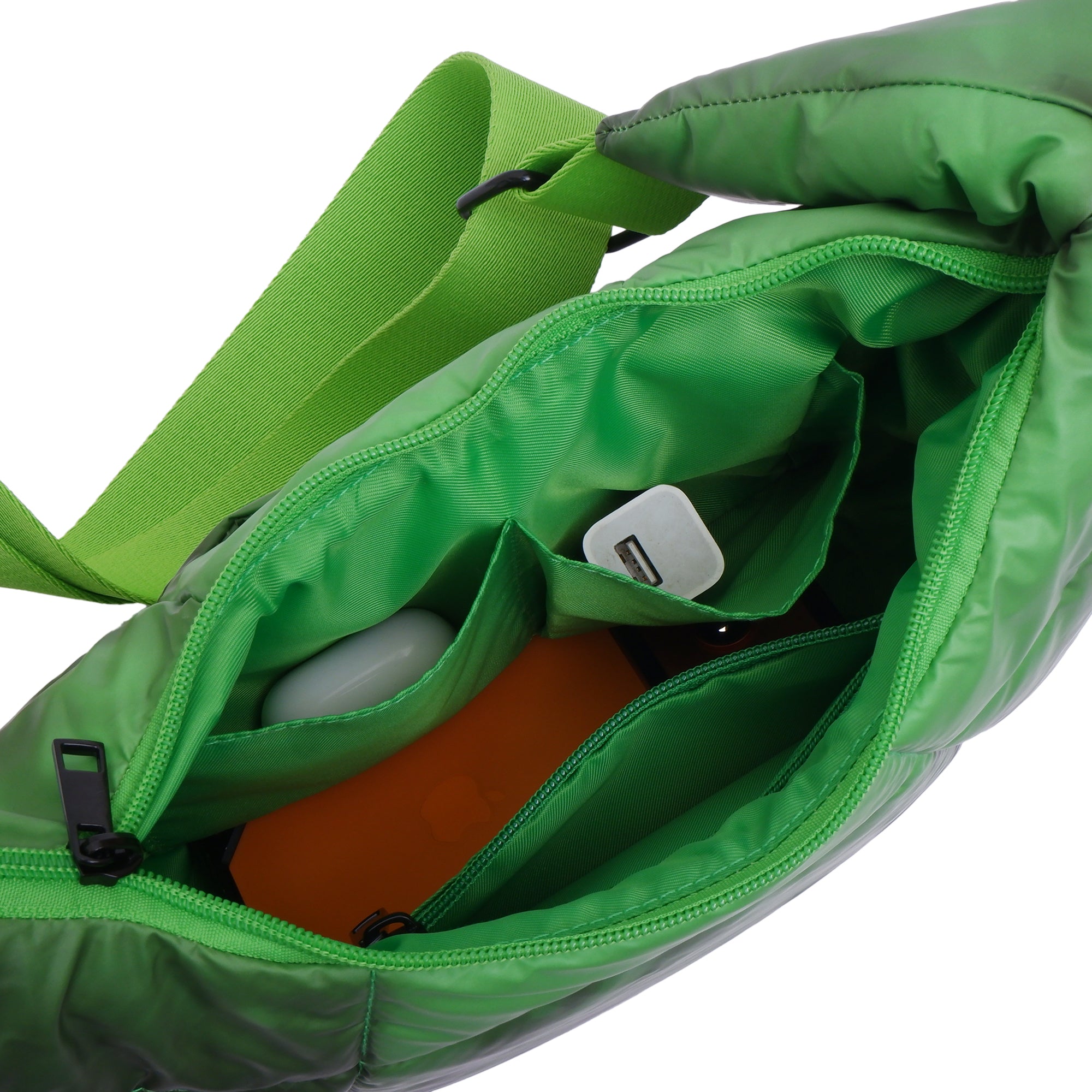 Green bag with a white item inside on a white background