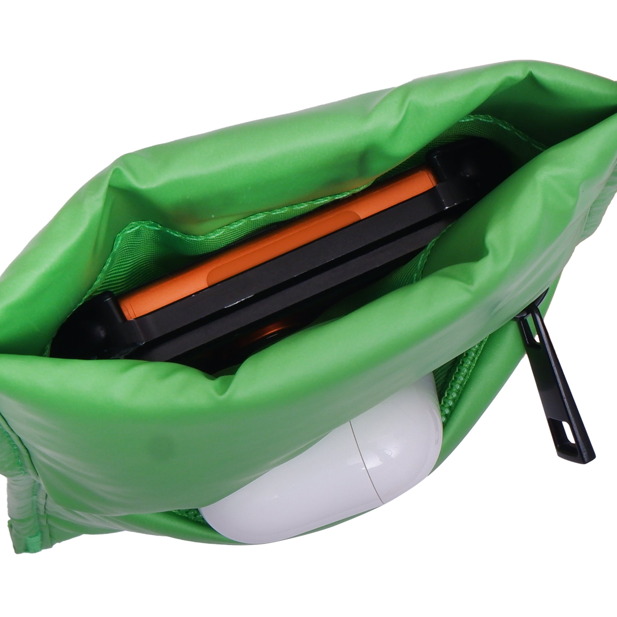 Green bag with a black and orange tool inside on a white background