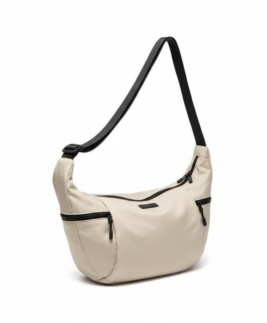 Black bag with orange interior on a light gray background.Waterproof tote bag with a durable exterior and a bright orange interior. Features an adjustable strap and multiple pockets for organization. Ideal for travel, gym, or daily use in India.