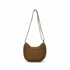 Brown shoulder bag on a white background,Trendy emerald green crescent half-moon shoulder bag for women, durable canvas, versatile for daily use, ethnic wear, and casual outings in India. This stylish sling bag offers a modern minimalist design, spacious interior, functioning as a chic carryall or small hobo tote.