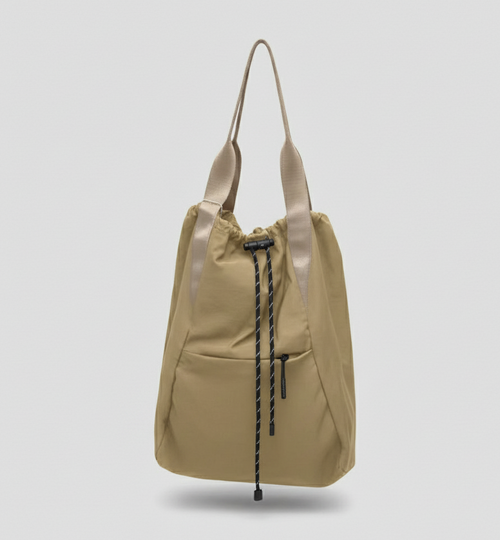 Beige backpack with drawstring on a light gray background,"Stylish khaki drawstring tote bag with multiple compartments and adjustable straps, perfect for daily use, shopping, and travel in India. Features include a secure zippered pocket, spacious main compartment, and comfortable shoulder straps. Ideal for fashion-conscious individuals seeking a versatile and trendy bag."