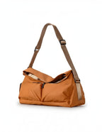 Orange handbag with a brown strap on a white background.Black bag with storage capacity features displayed on a white background,A padded, water-resistant shoulder bag with a roomy interior, zip closure, and adjustable strap, designed for everyday carry and positioned as a stylish alternative to popular Indian brands like Zouk, Miraggio, Lavie, Caprese, and DailyObjects. Brown backpack on a white background,A padded, water-resistant shoulder bag with a roomy interior, zip closure, and adjustable strap, desi