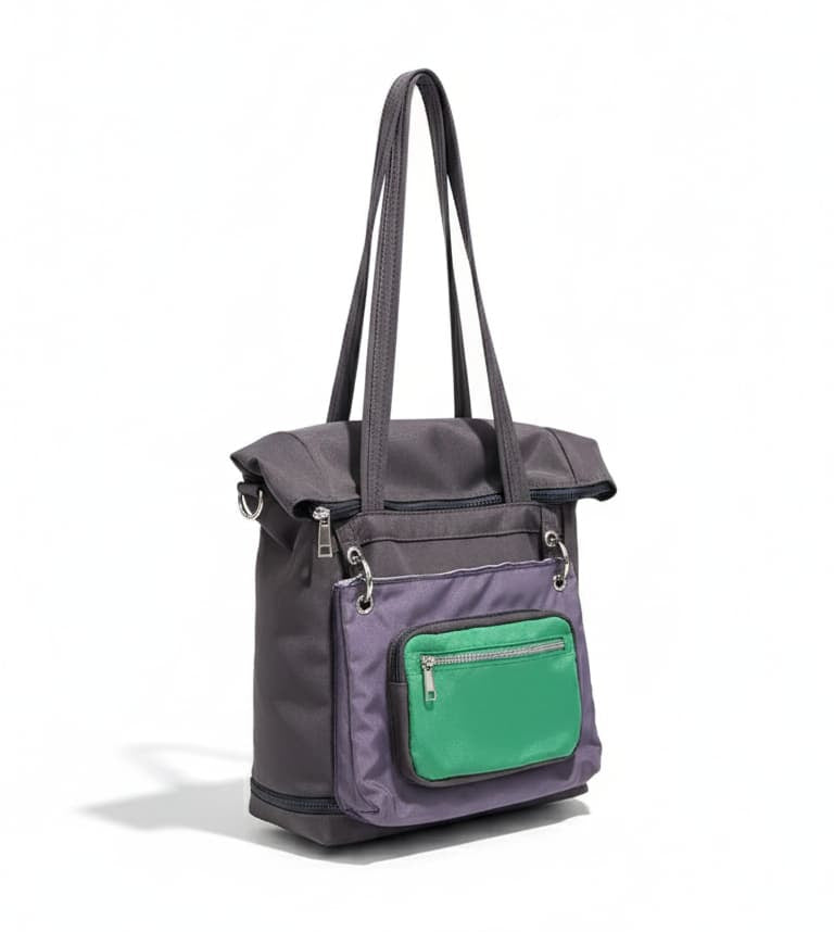 Gray handbag with a green pocket on a white background