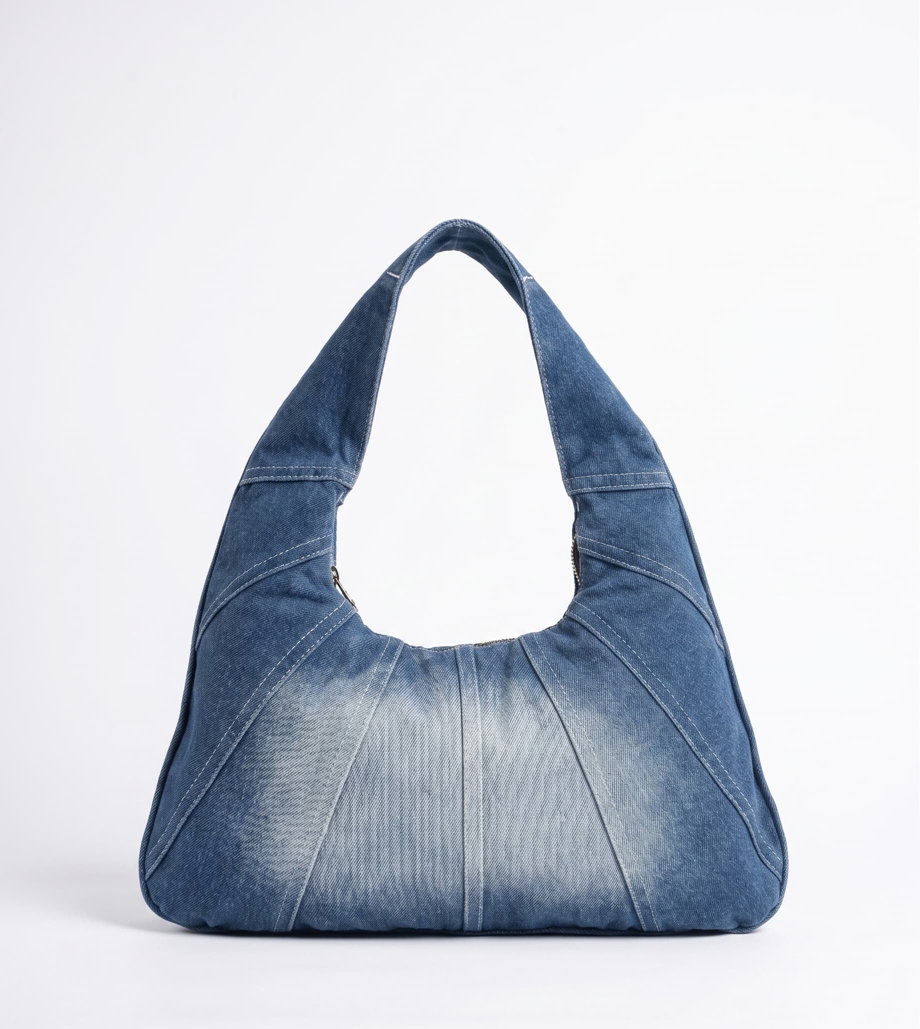 Blue denim handbag on a white background