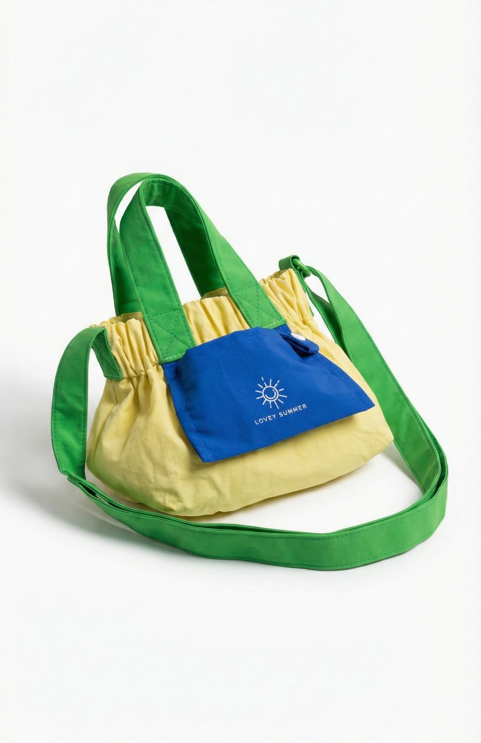 Green and yellow bag with a blue pocket on a white background