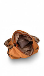 Brown backpack on a white background,Black bag with storage capacity features displayed on a white background,A padded, water-resistant shoulder bag with a roomy interior, zip closure, and adjustable strap, designed for everyday carry and positioned as a stylish alternative to popular Indian brands like Zouk, Miraggio, Lavie, Caprese, and DailyObjects.