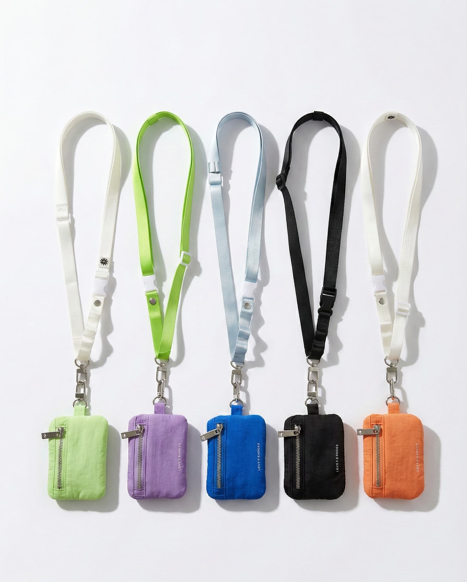 Set of five colorful keychains with lanyards on a white background