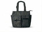 Black tote bag with multiple pockets on a white background Bag 004 black unisex streetwear utility tote bag India made from heavy premium canvas with structured oversized silhouette, minimal urban design and reinforced shoulder straps, functional everyday carry tote for college, office, travel and city lifestyle, durable street style bag inspired by Urban Monkey, H&M and Zara street collections, large capacity tote for laptop, books and daily essentials, modern Indian street fashion accessory for men and wo