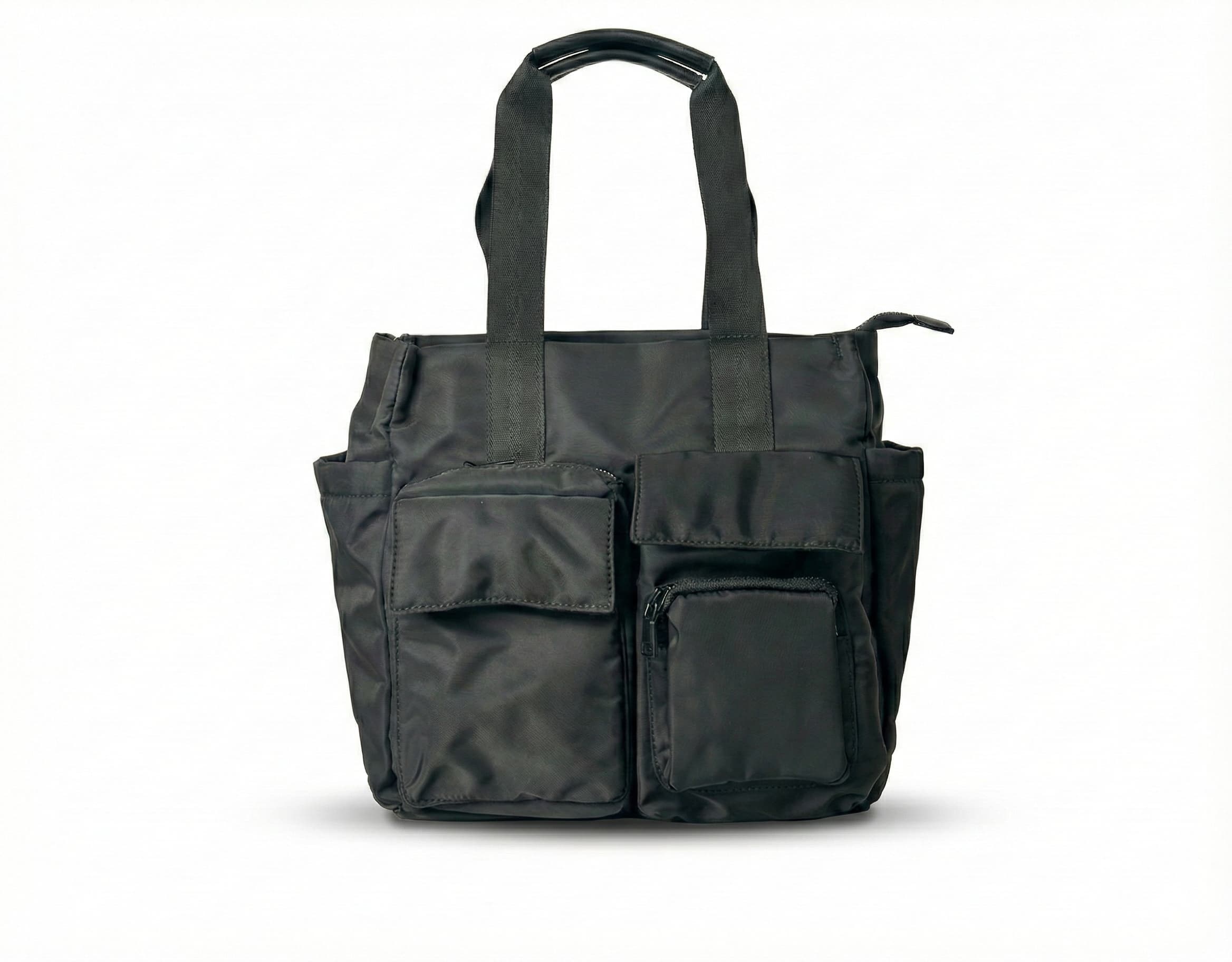 Black tote bag with multiple pockets on a white background Bag 004 black unisex streetwear utility tote bag India made from heavy premium canvas with structured oversized silhouette, minimal urban design and reinforced shoulder straps, functional everyday carry tote for college, office, travel and city lifestyle, durable street style bag inspired by Urban Monkey, H&M and Zara street collections, large capacity tote for laptop, books and daily essentials, modern Indian street fashion accessory for men and wo