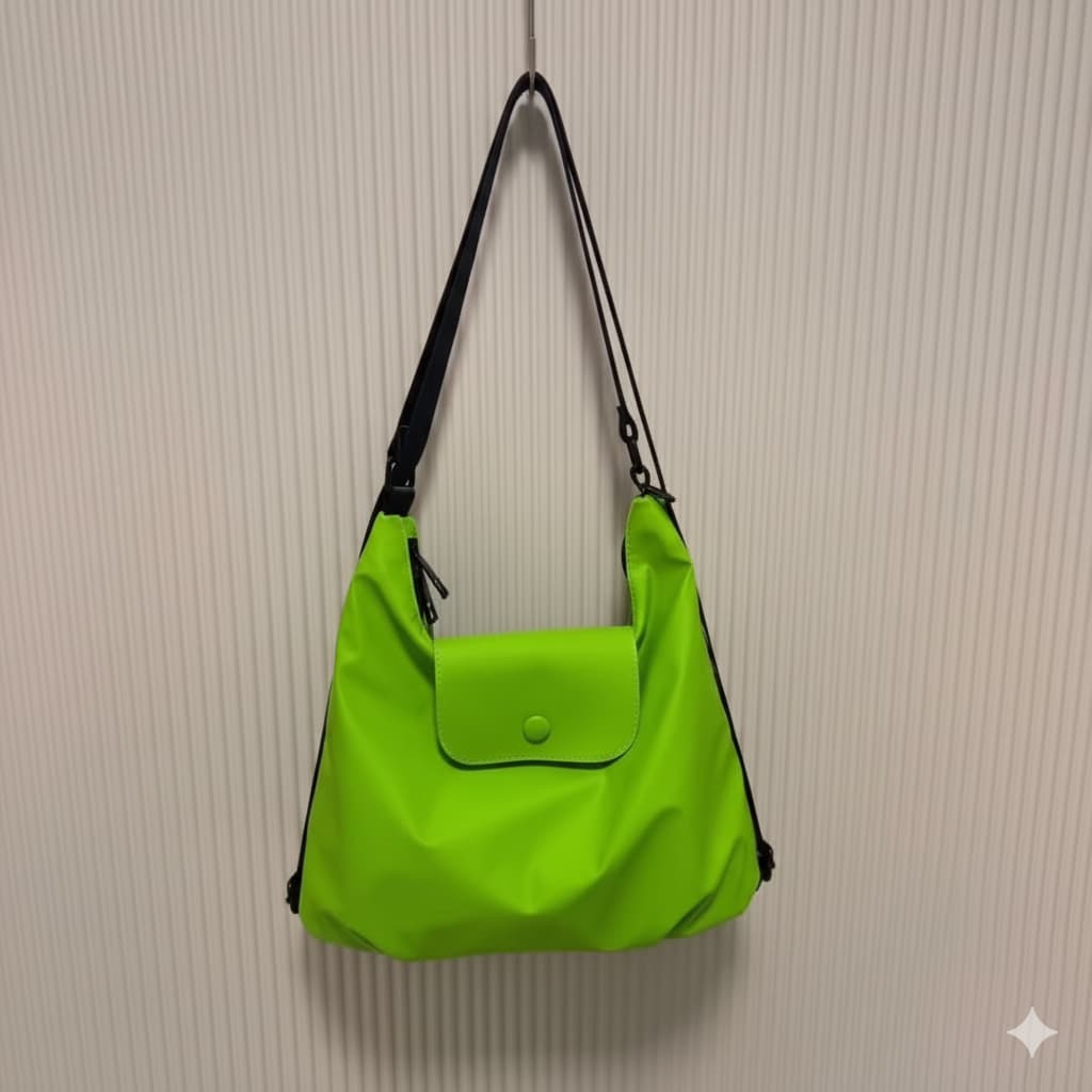 Green handbag with black strap on a beige textured wall,laptop tote bag for women, tote bag for office use, college tote bag with zipper, and stylish bags for girls. You can also target users with specific needs by using long-tail phrases like vegan leather tote bag or tote bag for daily use in India. To understand the market better, keep an eye on competitors such as Lavie, Baggit, and Caprese, all of which are major players in the Indian handbag space, along with brands like Zouk and Hidesign that cater t