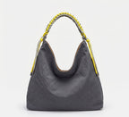 A dark gray crinkled leather hobo bag with a braided yellow and gray shoulder strap, shown against a plain white background.