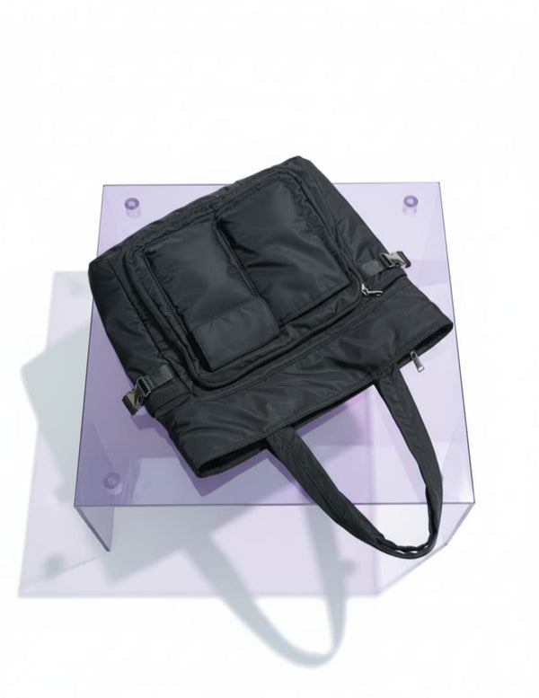 Black bag on a transparent stand with a white background